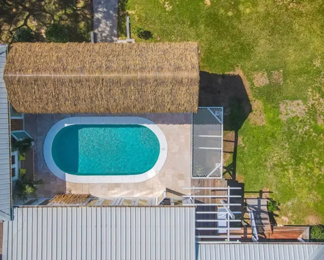 The pool and thatched roof seen from above