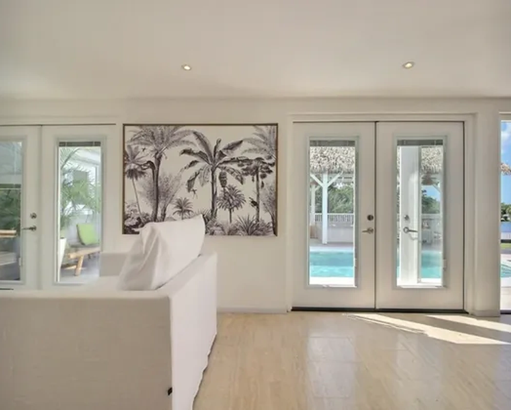 The patio opening onto the pool