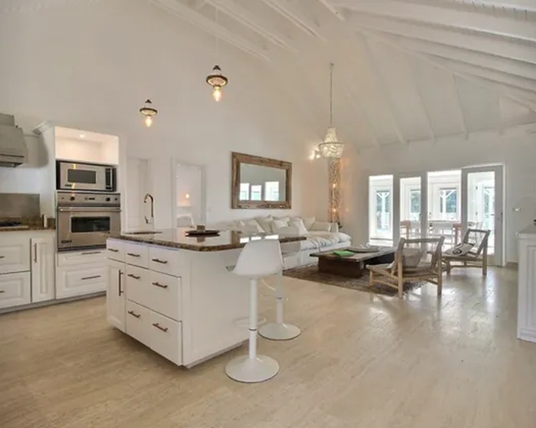 The kitchen opening onto the living room