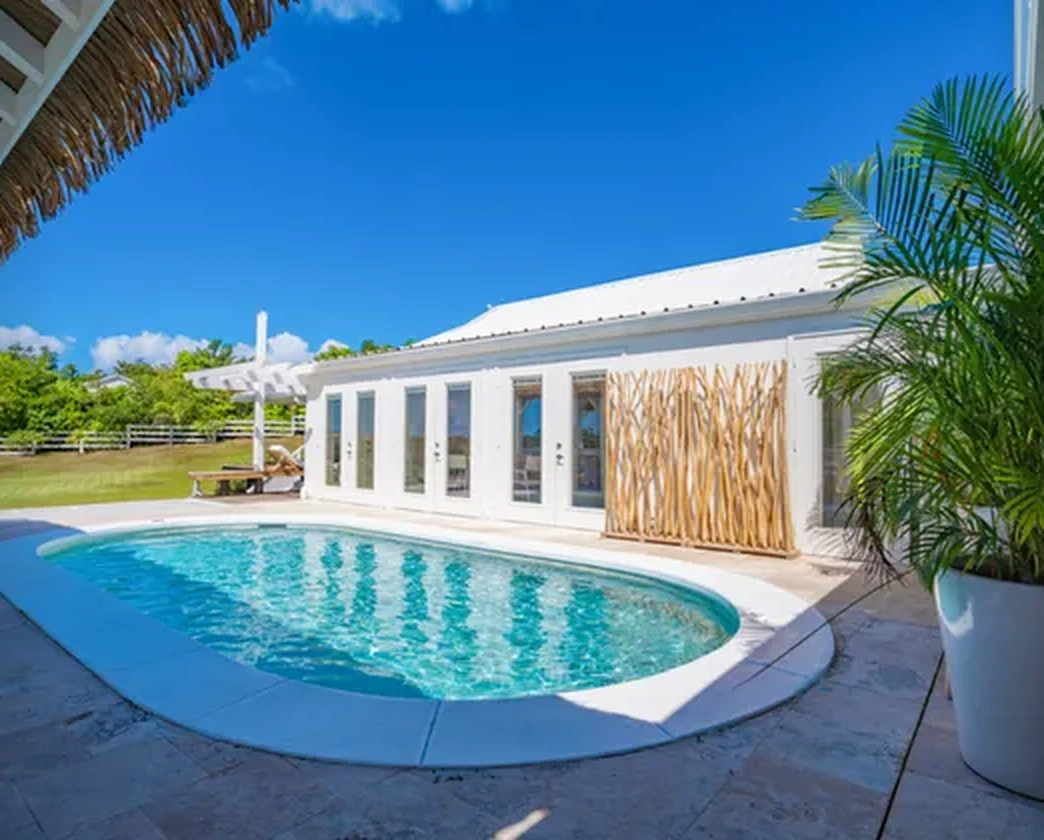 The pool facing the villa’s glass doors